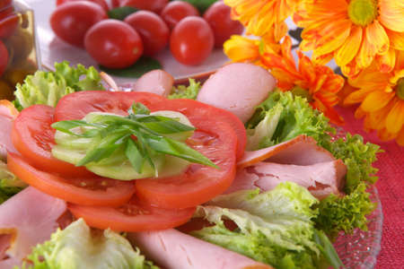 Fresh salad with onion, tomato and basilの写真素材