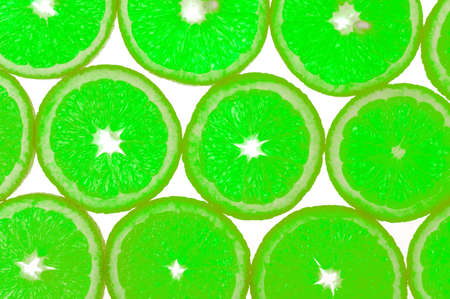 Fresh lime fruits isolated on whiteの写真素材