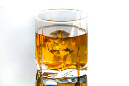 Whiskey in glass with ice cubesの写真素材