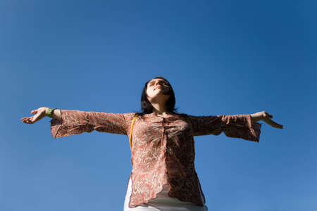 Women on blue sky background
