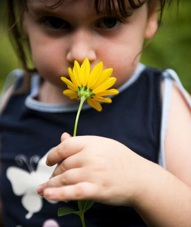 Child with flower portraitの写真素材