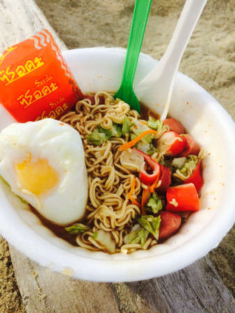 Egg with Spicy Thai Tomyam instant noodlesの写真素材