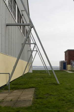 Flying buttresses on side of modern prefabricated building.の写真素材