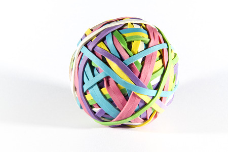 Ball of brightly coloured rubber bandsの写真素材
