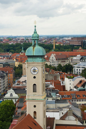 Verdigris covered Lantern Dome and clock. Tower of Heiliggeistkirche church. Munich, Bavaria, Germany, Europe.のeditorial素材