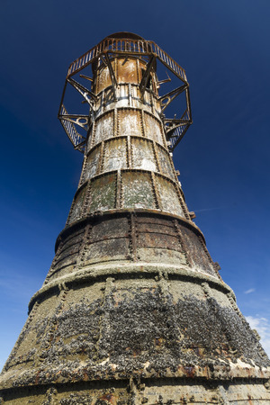 Whiteford Lighthouse is the only wave swept cast iron lighthouse in Britain. See here at low tide. Whiteford Point, Whiteford Sands, Gower Peninsular, South Wales, United Kingdom, Europe.の写真素材