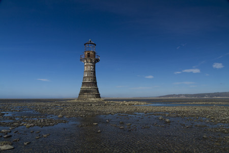 Whiteford Lighthouse is the only wave swept cast iron lighthouse in Britain. See here at low tide. Whiteford Point, Whiteford Sands, Gower Peninsular, South Wales, United Kingdom, Europe.の写真素材