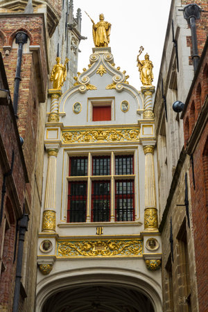 Renaissance Guilded gate, part of Aaron Civil Registry date 1543, and an entrance to Burg Square, Square. Bruges, West Flanders, Belgium, Europeのeditorial素材
