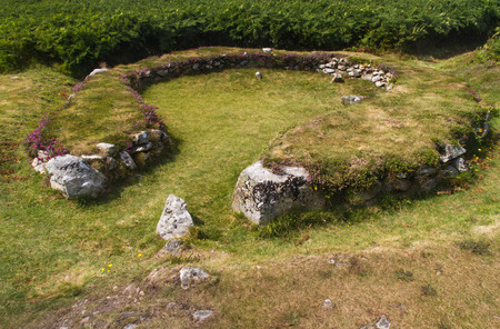Remains of hut, now a circle. Settlement of about twenty buildings dating 2000BC, Bronze Age. Holyhead, Anglesey, Wales, United Kingdomの写真素材