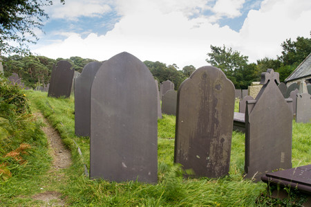 Backs of gravestones, made from dark blue slate. Menai Bridge, Anglesey, Wales, United Kingdom.の写真素材