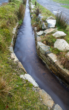 Water channel, old structure. Leat, Dartmoor National Park, Devon, England, United Kingdom.の写真素材