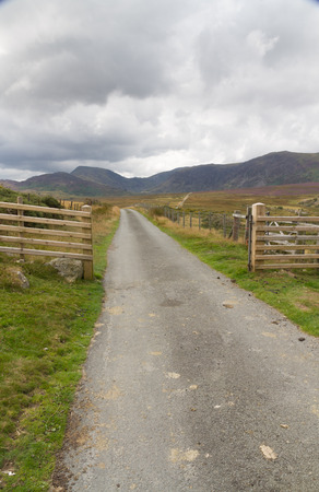Track into Cwm Eigiau with Carnedd Mountains in the distance. Conwy Snowdonia National park Gwynedd Wales United Kingdom.の写真素材