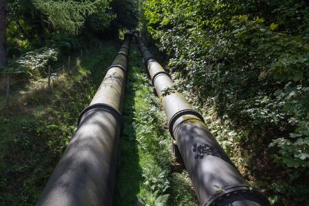 Two water pipes. The pipeline carries water from Coedty reservoir the Dolgarrog hydro electric power stationの写真素材