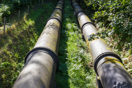 Two water pipes. The pipeline carries water from Coedty reservoir the Dolgarrog hydro electric power stationの写真素材