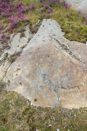 Rock Cannon were holes drilled in rock used in celebrations when gunpowder exploded. This associated with Dinorwic Slate Quarry Snowdonia Wales United Kingdomの写真素材