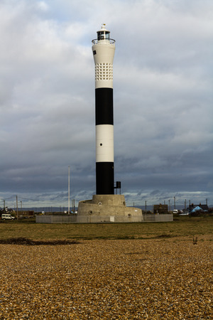 Black and white banded modern lighthouse. Dungeness New Lighthouse, Kent, England, United Kingdom.の写真素材