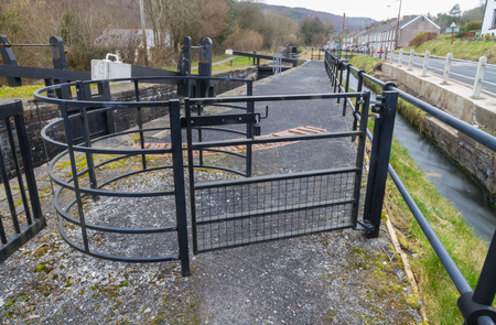 Gate used in the United Kingdom to allow people but not livestock to pass. By canal lock.の写真素材