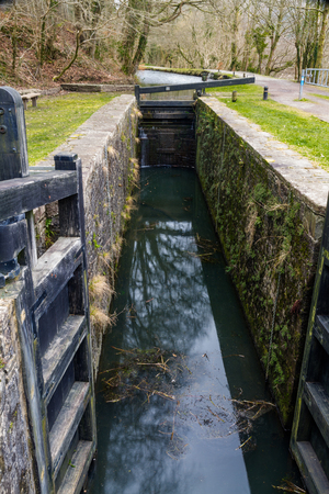 Closed single gate lock. Resolven Basin, Neath Canal. Resolven, Vale of Neath, Port Talbot, Wales, United Kingdom.の写真素材
