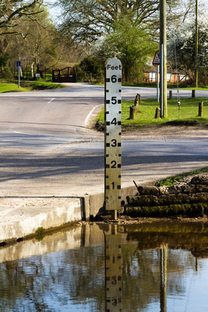 Indicator of stream or river level, currently below minimum.の写真素材