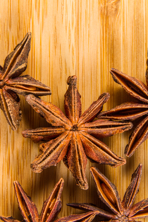 Close up of star anise spice, wood background, macro.の写真素材