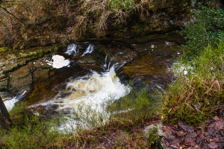 Sgwd Isaf Clun-Gwyn Falls, waterfall. Pontneddfechan, Vale of Neath, Powys, Wales, United Kingdom, winter.の写真素材