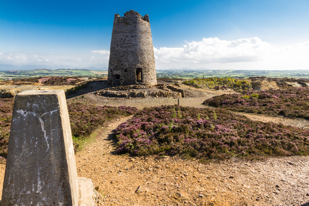 Triangulation point and derelict windmill. Parys Mountain, Amlwch, Anglesey, Wales, United Kingdomの写真素材