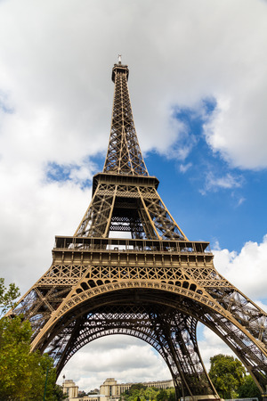 Eiffel Tower against blue sky and clouds. France, Europe.の写真素材