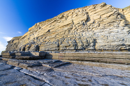 Carboniferous limestone cliffs of Southerndown Beach or Dunraven Bay, afternoon light. Used as Bad...