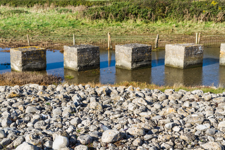 Anti-tank cubes from World War II to prevent invasion. Aberthaw beach, South Wales, United Kingdom, Europeの写真素材