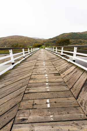 Wooden structure Penmaenpool toll bridge, over the River Mawddach near Dolgellau, Wales, United Kingdomの写真素材