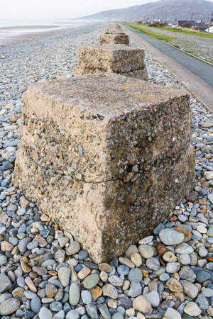 Anti-tank cubes from World War II to prevent invasion. Fairbourne beach, North Wales, United Kingdom, Europeの写真素材
