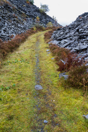 Path between slate tips. Wales, United Kingdomの写真素材