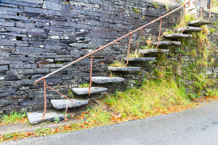Set of cantilevered steps, made of slate ascending wall.の写真素材