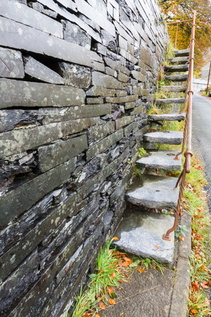 Set of cantilevered steps, made of slate ascending wall.の写真素材