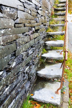 Set of cantilevered steps, made of slate ascending wall.の写真素材