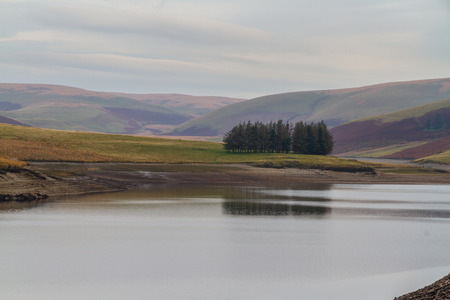The Claerwen Reservoir part of Elan Valley Reservoirs on a still Autumn Fall morning. Powys, Wales, United Kingdom.の写真素材