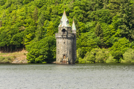 Gothic straining tower on Lake Vyrnwy reservoir. Powys, Wales, United Kingdom.の写真素材