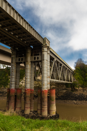 Chepstow Railway Bridge connects England and Wales crossing the River Wyeの写真素材