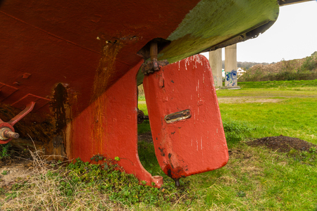 Vintage iron boat rudder, red paintの写真素材