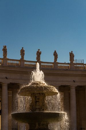 Fountain in St Peters Square in The Vatican, Italyの写真素材