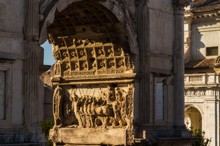 Evening Sun picking out relief carvings on the Arch of Titus in Rome, Italyのeditorial素材