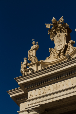 Detail at corner of Colonnades in St Peters Square, Vatican, Rome. Including daylight half moon.の写真素材