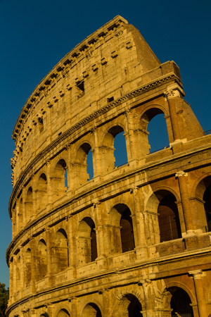 The Colosseum or Coliseum Roman Amphitheatre in late afternoon or eveningの写真素材