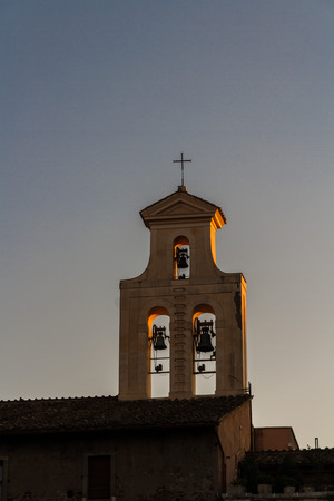 Bell tower in Rome catching last light of sunset.の写真素材