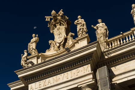 Detail at corner of Colonnades in St Peters Square, Vatican, Rome. Including daylight half moon.の写真素材