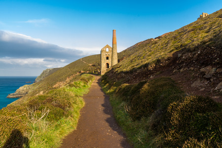 South west coast path approaching Towanroath shaft Engine House part of Wheal Coates tin mineの写真素材