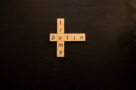 Toy letter blocks showing Trump and Putin like a crosswordの写真素材