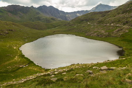 Miners track to summit of Snowdon passing LLyn Teryn lake. Snowdonia, Wales, United Kingdom.の写真素材