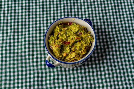 Bowl of homemade guacamole, ready for eating.の写真素材