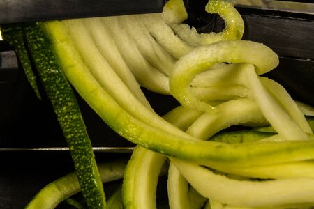 Spiralizer with spiralised zucchini or courgette, macro.の写真素材